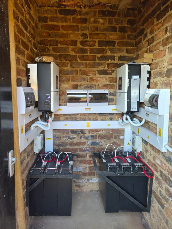Two Deye hybrid inverters with rack-mounted lithium batteries.